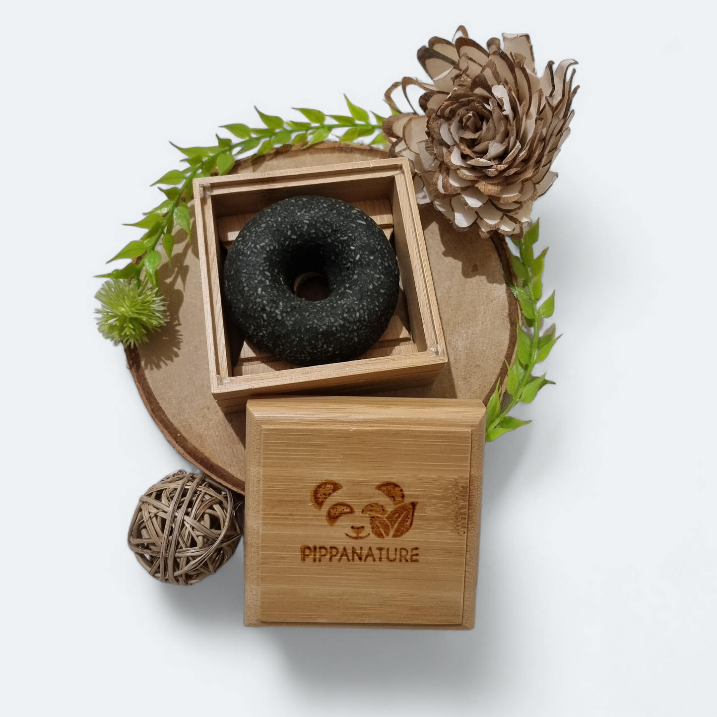 Bamboo Soap Box holding a solid shampoo bar, ideal for keeping it dry and prolonging its use, perfect for travel or home.